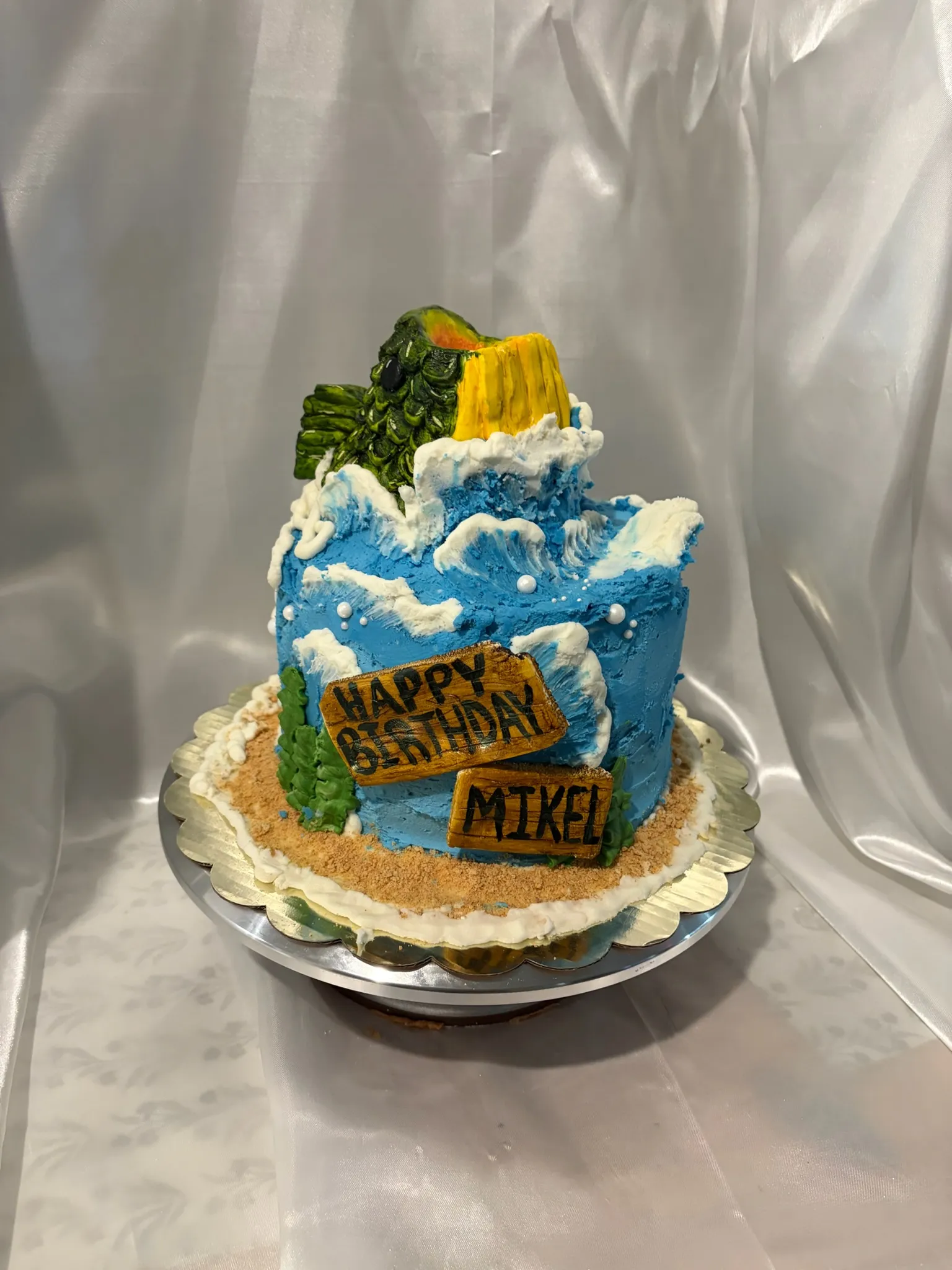 A sculpted birthday cake modelled as a snowy mountain scene