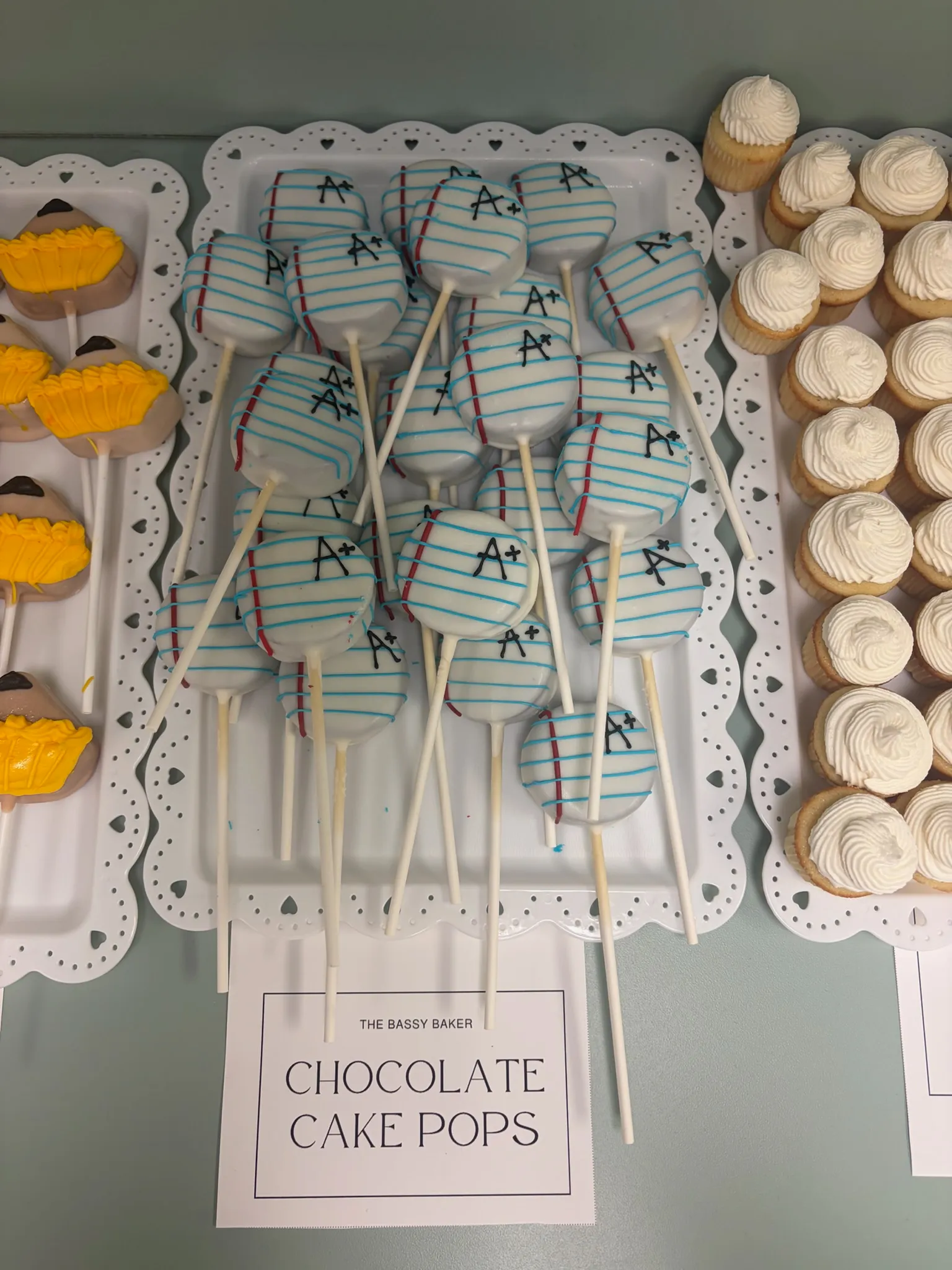 Chocolate cake pops arranged on a labelled tray