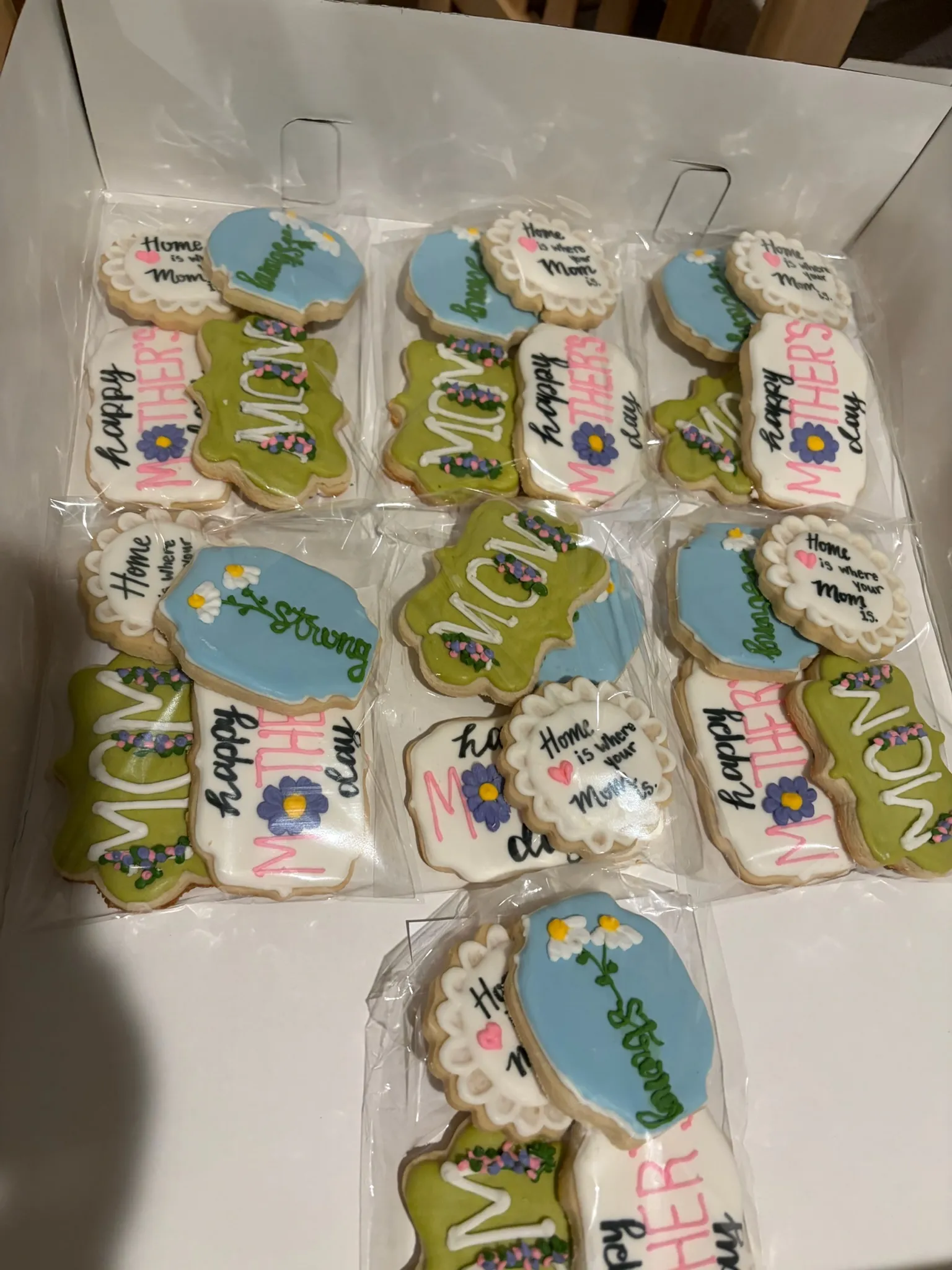 Pastel baby shower cookies individually wrapped and ribboned