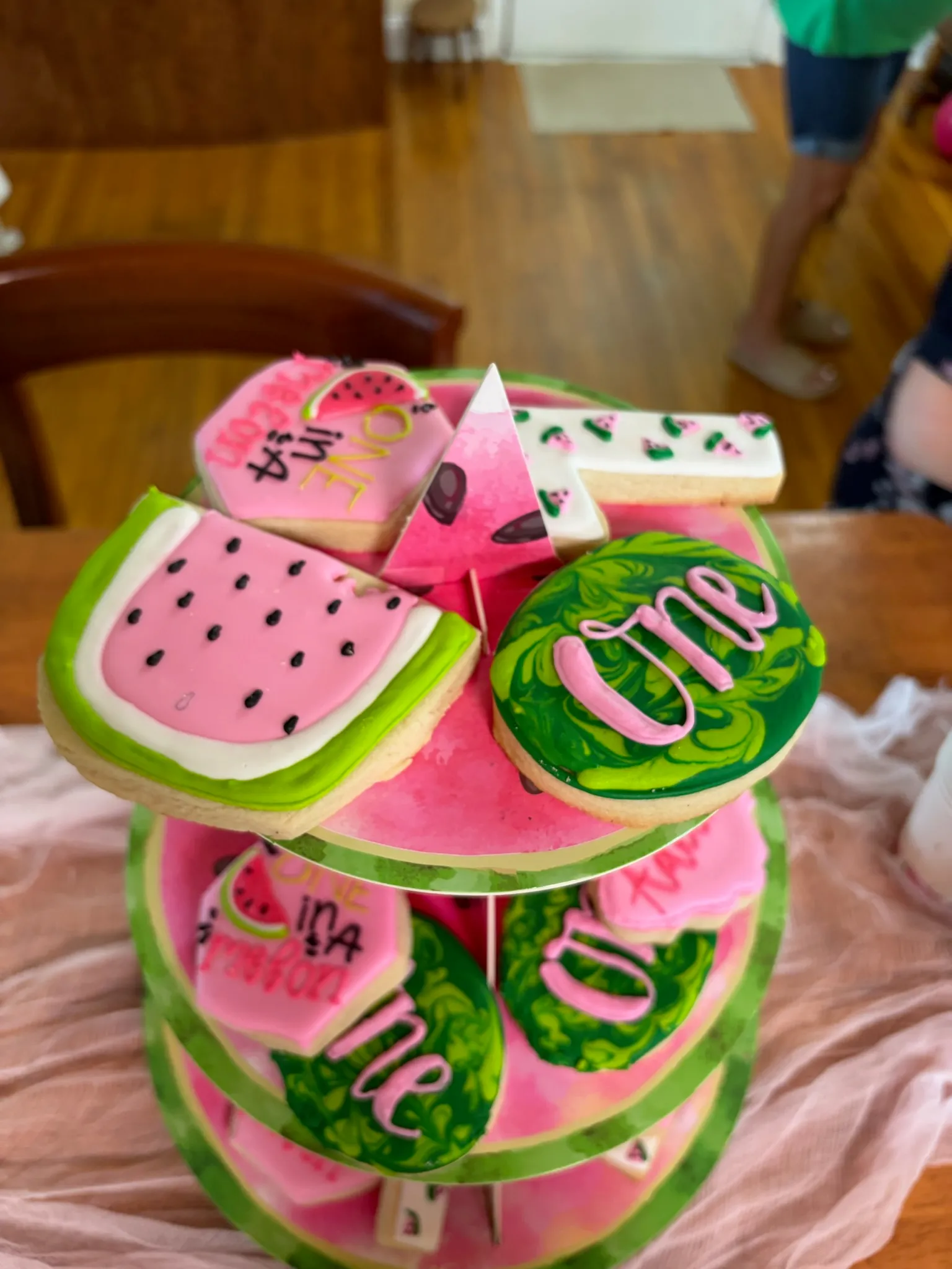 Watermelon-themed decorated cookies for a first birthday