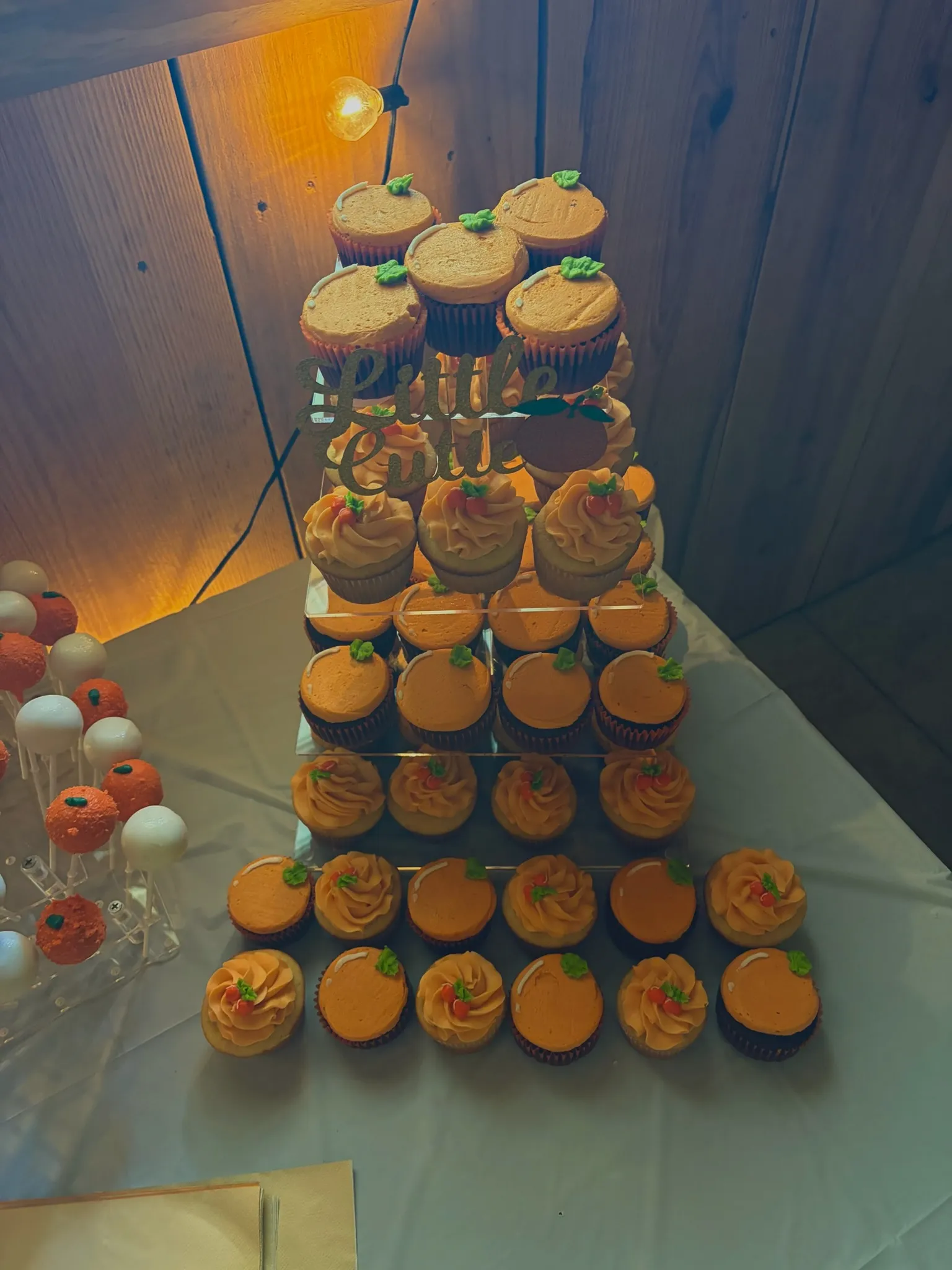 A tall cupcake tower set up for a party