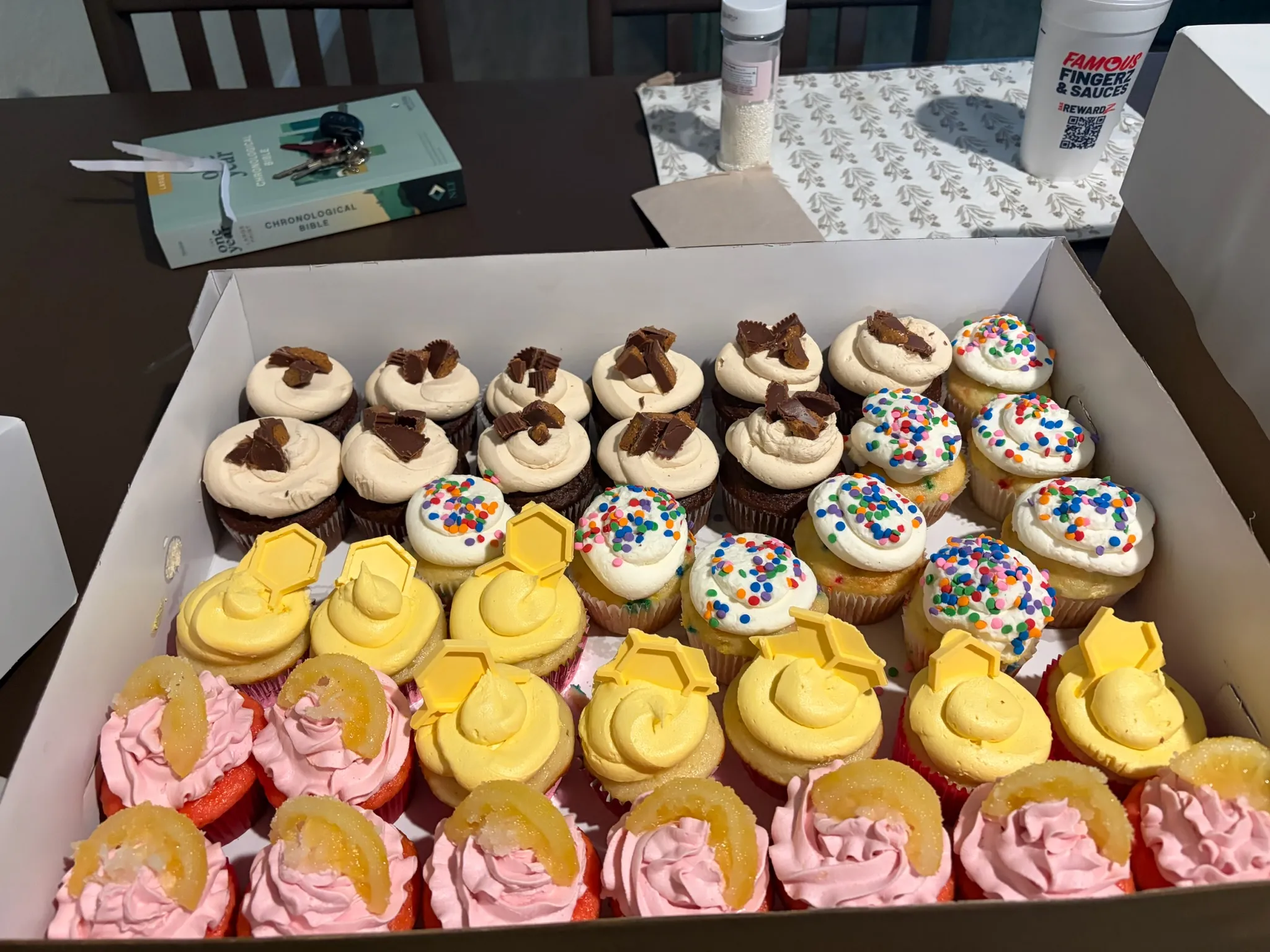 A tray of frosted cupcakes set out for a party